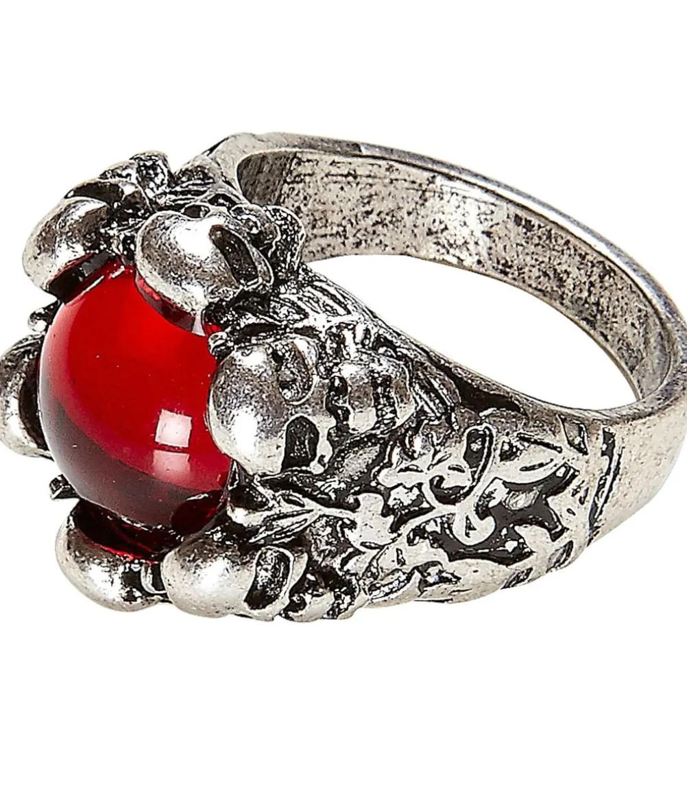 Ring med kranier og rød sten